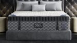Luxurious Puffy MONARCH mattress on elegant bed in modern, serene gray bedroom.