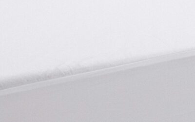 Minimalist bedsheet textures in white and gray exude tranquility and modern simplicity.
