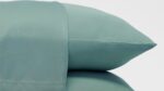 Mint-green pillowcases offering tranquility and freshness for a peaceful, stylish bedroom decor.
