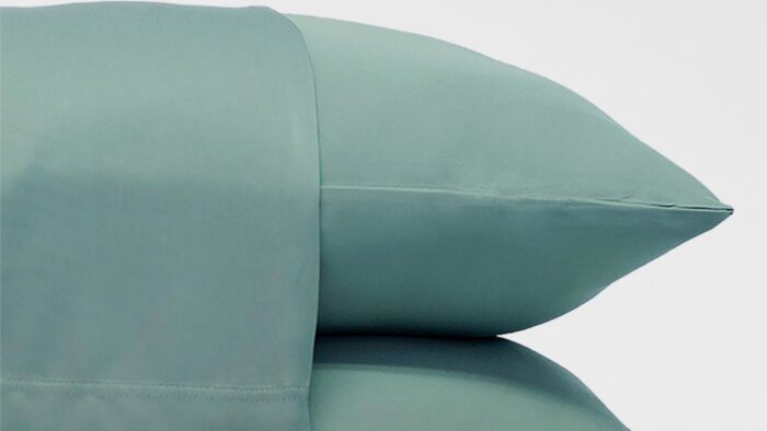 Mint-green pillowcases offering tranquility and freshness for a peaceful, stylish bedroom decor.