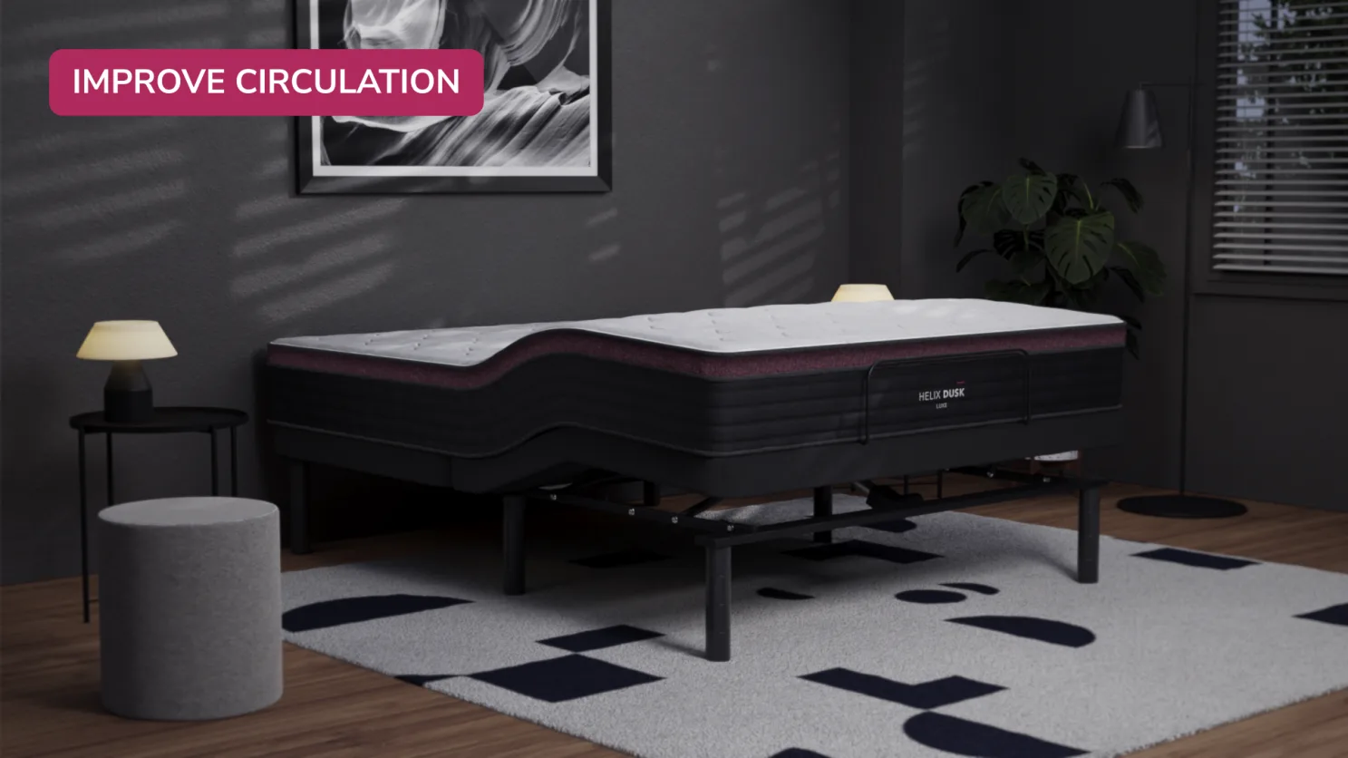 Contemporary adjustable bed in a modern bedroom with cozy lighting and monochrome decor.