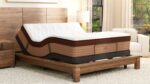Modern bedroom with adjustable mattress, wooden bed frame, and calming natural light.