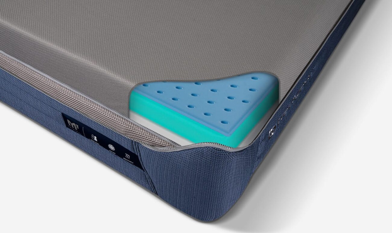 Modern mattress with breathable blue foam layer for comfort and support.