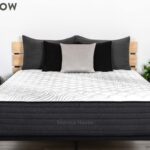 Modern bedroom with Bungalow mattress, minimalist wood frame, and stylish nightstands.