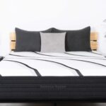 Modern bedroom with LOFT Extra Firm Hybrid mattress and sleek, monochromatic design elements.