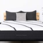 Modern bedroom with LOFT Hybrid bed, sleek design, cozy pillows, and minimalist decor.