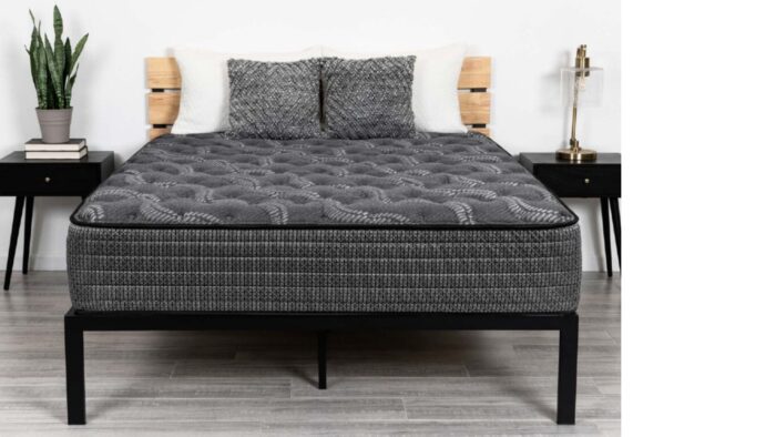 Modern bedroom with plush mattress, stylish decor, and serene ambiance.