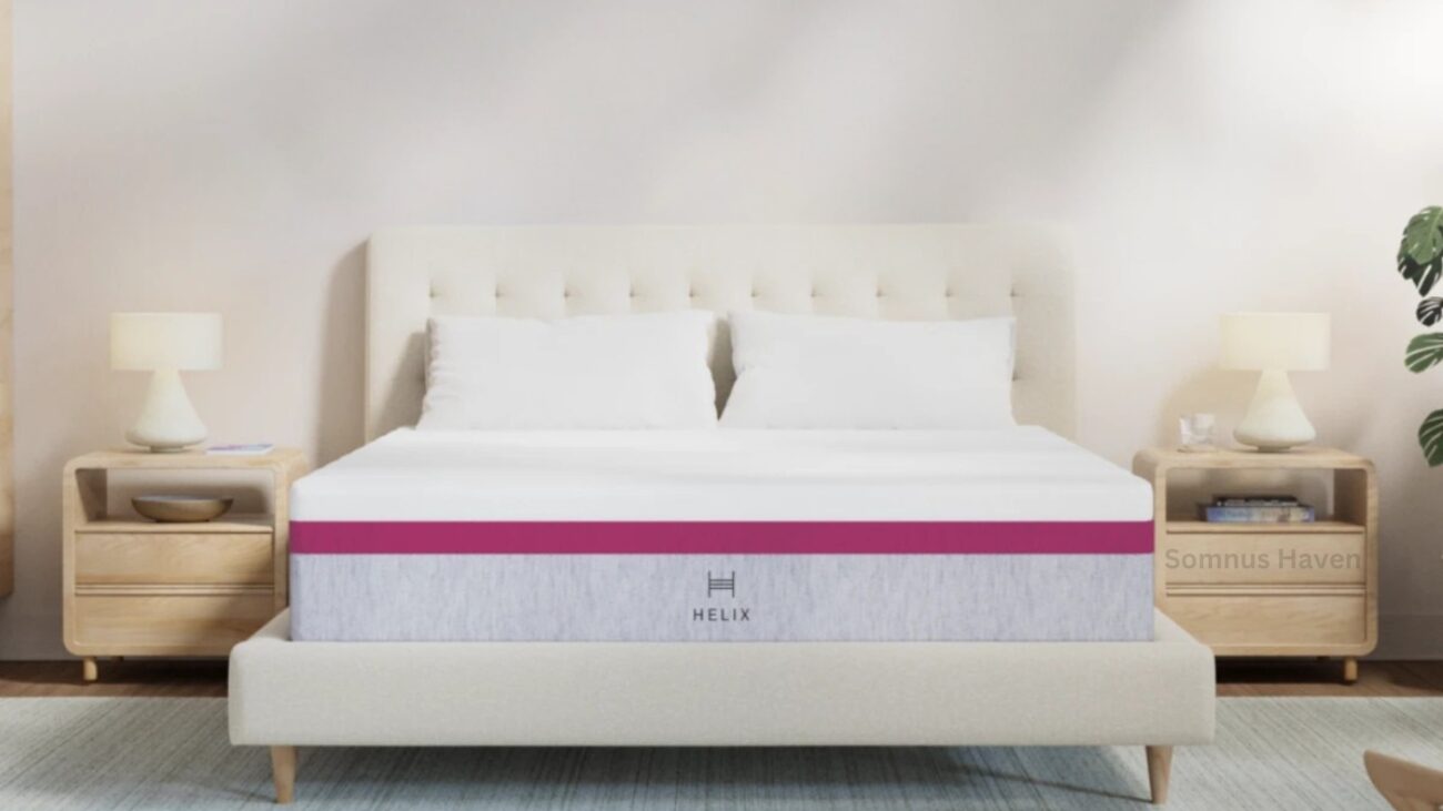 Modern bedroom with cream headboard, gray mattress, pink accents, and wood furniture.