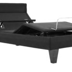 Modern adjustable bed frame with sleek design, black upholstery, and functional comfort features.