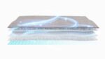 Futuristic multi-layered material with smart, energy-flowing blue lines and cushioning white layers.