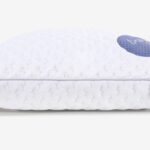 Modern white pillow with oval design and blue cooling patch for ergonomic comfort.