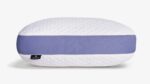 Oval pillow with quilted white top and lavender side band for modern bedroom decor.