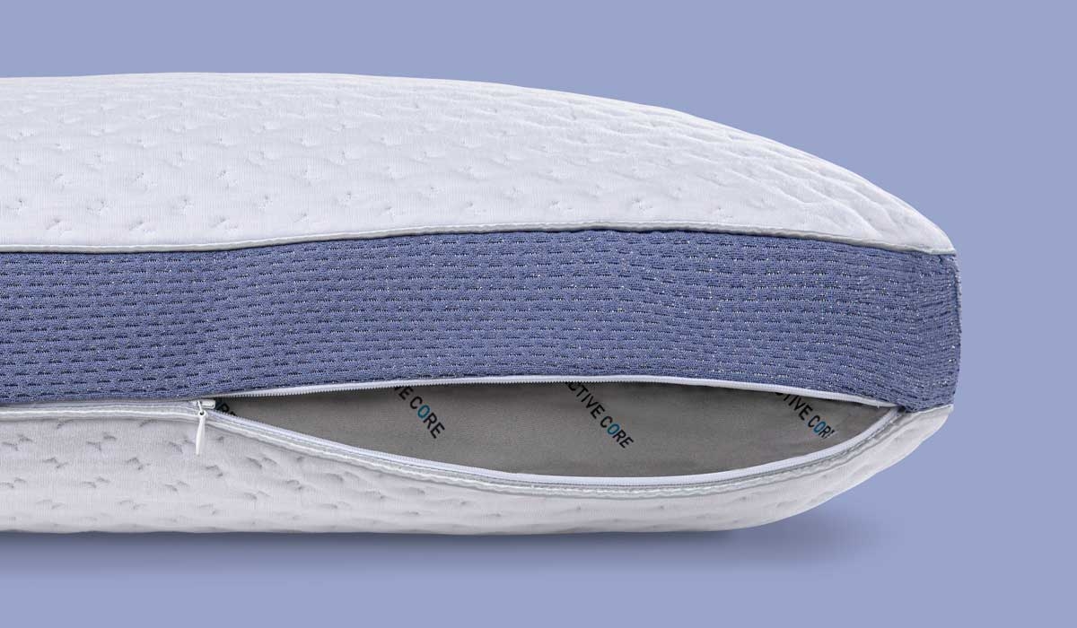 Luxurious adjustable pillow with quilted cover, grayish-blue band, and convenient zipper.