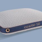 Modern Cosmo 1.0 pillow with navy, gold details, and textured fabric for stylish comfort.