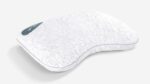 Ergonomic white pillow with wave design for head and neck support, featuring geometric texture.