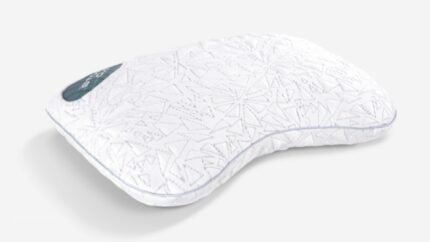 Ergonomic white pillow with wave design for head and neck support, featuring geometric texture.