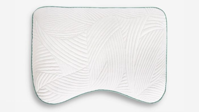 Ergonomic decorative pillow with wave pattern for lumbar support and modern style.