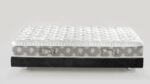 Modern plush mattress with quilted top on sleek black platform base for stylish bedrooms.