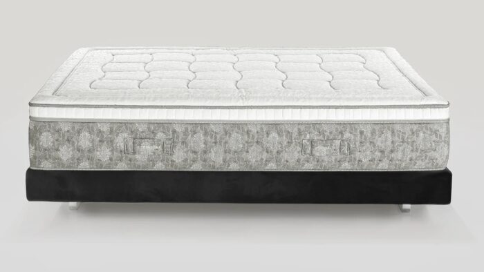 Luxurious quilted mattress with elegant design on a sturdy base for stylish comfort.
