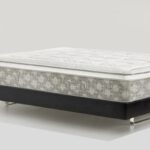 Modern mattress with sleek design, neutral tones, and a sturdy platform base.