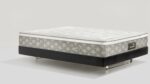 Modern mattress with sleek design, neutral tones, and a sturdy platform base.