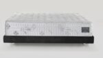 Luxurious white mattress with quilted tufting on sleek black frame; ideal for modern bedrooms.