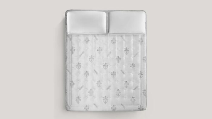 Luxurious tufted mattress with floral patterns, creating an inviting and serene bedroom atmosphere.