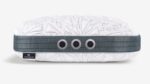 Modern ergonomic pillow with geometric design, ventilation features, and stylish branding for comfort.