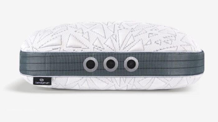 Modern ergonomic pillow with geometric design, ventilation features, and stylish branding for comfort.