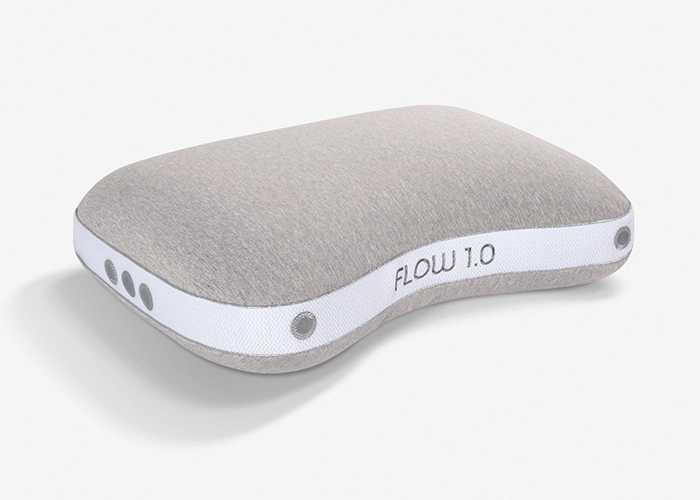 Ergonomic pillow Flow 1.0: contour design, gray plush fabric, modern style, ventilation features.