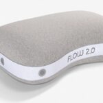 Ergonomic gray pillow with contoured design, FLOW 2.0 label, offers customizable support.