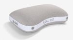 Ergonomic gray pillow with contoured design, FLOW 2.0 label, offers customizable support.