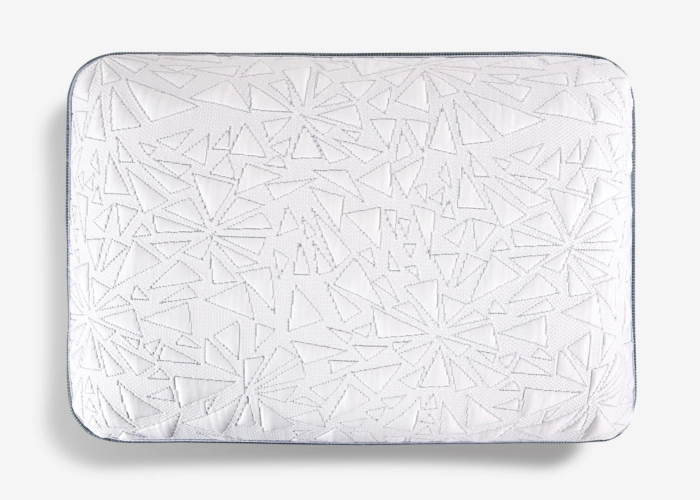 White cushion with geometric pattern, precise stitching, and subtle trim for modern interiors.