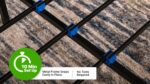 Black metal bed frame with blue clips, easy setup, tool-free assembly, resting on textured carpet.