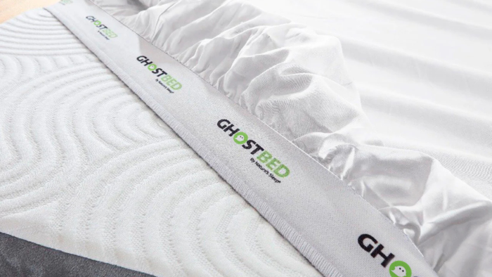 GhostBed mattress with plush surface, modern design, and enhanced sleep quality branding.