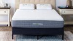 Modern bedroom with sleek mattress, pillows, and minimalist furnishings for stylish comfort.
