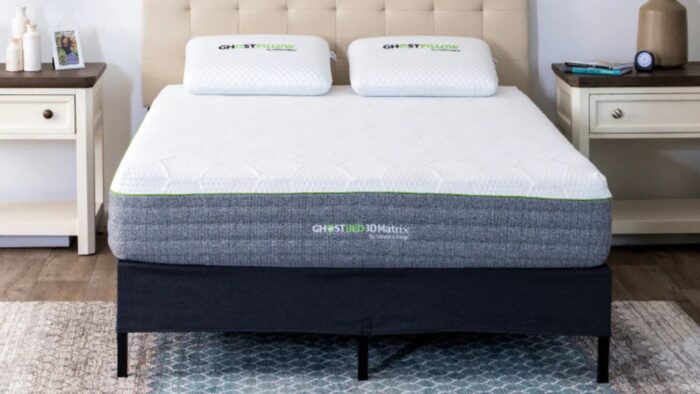 Modern bedroom with sleek mattress, pillows, and minimalist furnishings for stylish comfort.