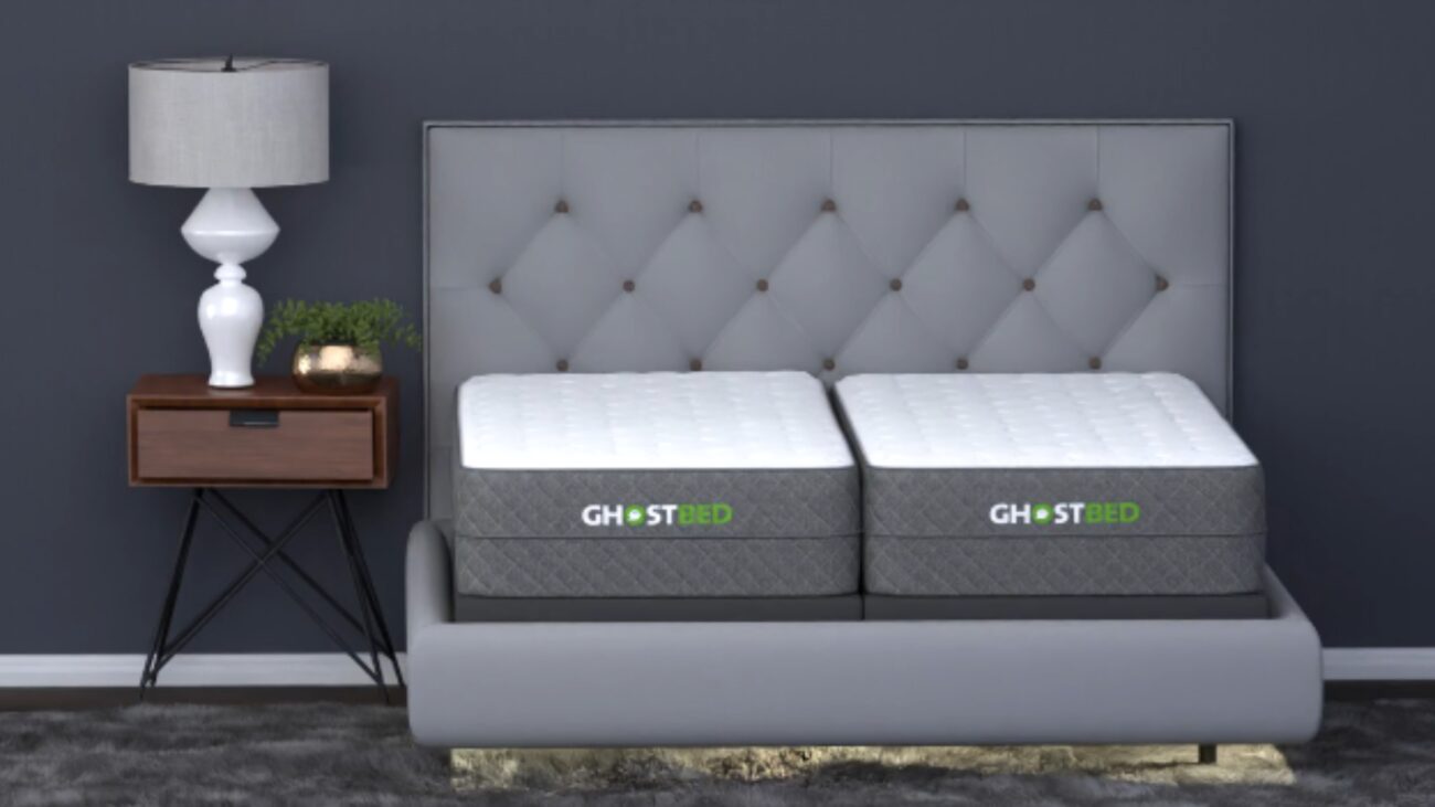 Modern bedroom with GHOSTBED mattresses, tufted headboard, chic nightstand, and inviting decor.
