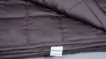 GhostBed quilted taupe blanket: stylish, warm, and ideal for bedroom or living room decor.