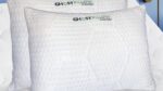 GhostPillow by GhostBed: Plush, ergonomic white pillows exuding comfort and cleanliness.