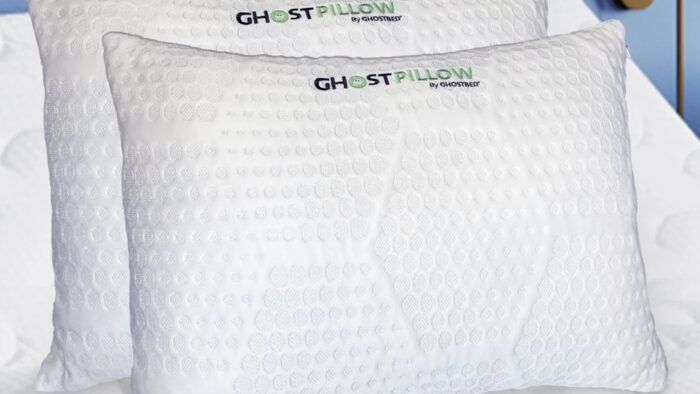 GhostPillow by GhostBed: Plush, ergonomic white pillows exuding comfort and cleanliness.