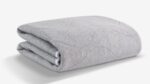 Plush gray fleece blanket with quilted pattern, perfect for modern and cozy decor.