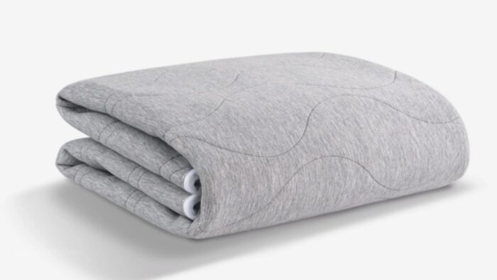 Plush gray fleece blanket with quilted pattern, perfect for modern and cozy decor.