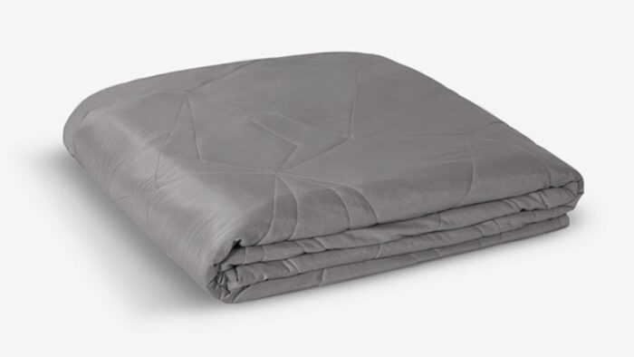 Modern gray quilt with geometric pattern, plush texture, and smooth fabric for versatile decor.