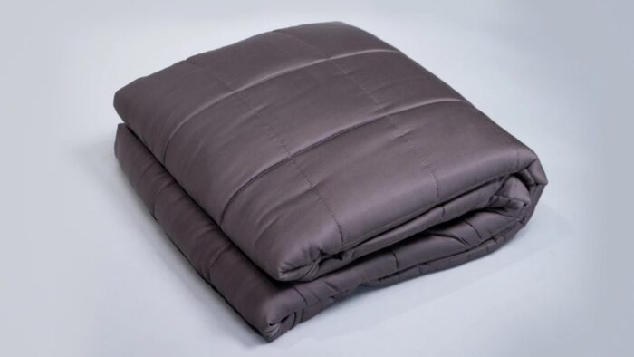 Charcoal gray quilted comforter, elegant design, plush warmth, versatile bedroom decor.