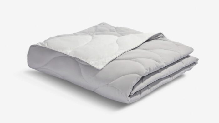 Soft grey quilted comforter for warmth and style in any bedroom or living space.