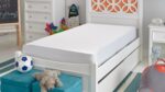Bright kids room with stylish bed, orange accents, and playful decor.