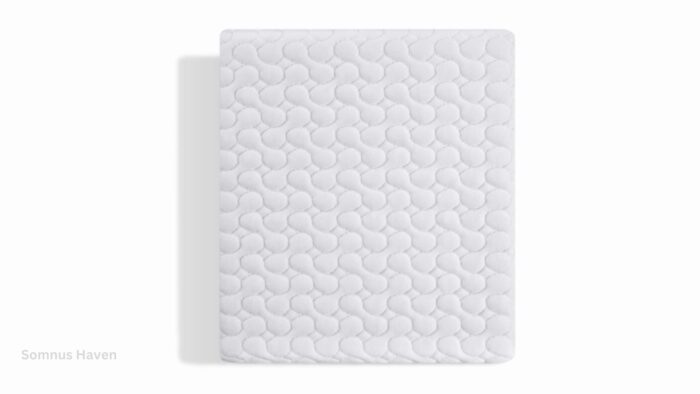 Close-up of plush white mattress with textured quilting for comfort and modern aesthetics.