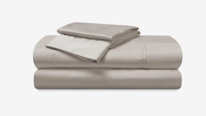 Elegant beige bedding set with quality fabric, minimalist design, promoting tranquility in bedrooms.