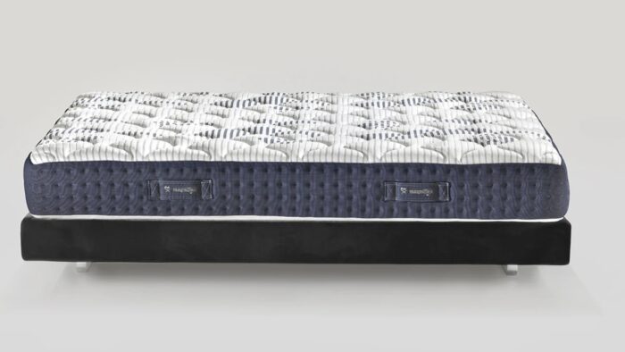 Luxury plush mattress with quilted white top, navy sides, and black foundation for modern elegance.